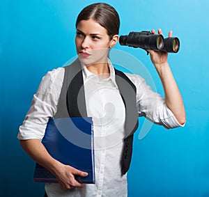 Business woman with a binoculars