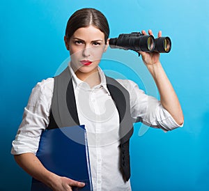 Business woman with a binoculars