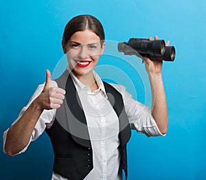 Business woman with a binoculars