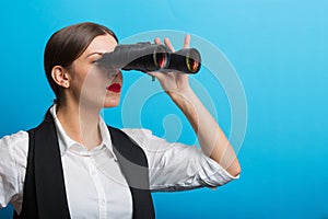 Business woman with a binoculars