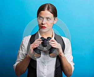 Business woman with a binoculars