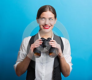 Business woman with a binoculars