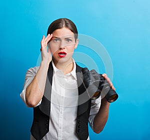 Business woman with a binoculars