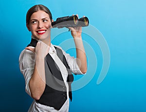 Business woman with a binoculars