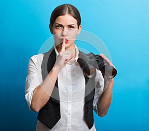 Business woman with a binoculars