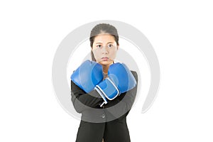 Business woman in boxing gloves cross arms