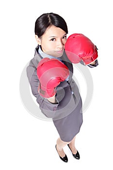 Business woman with boxing gloves in full length