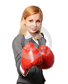 Business woman with boxing gloves isolated