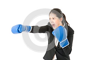 Business woman with boxing gloves shout