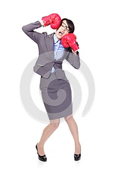 Business woman boxing and knock down itself