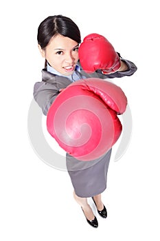 Business woman boxing punching towards