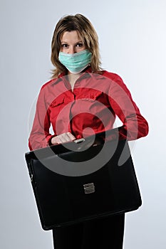 Business woman with briefcase and mask protection