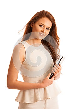 Business woman brousing the web on a tablet isolated over white