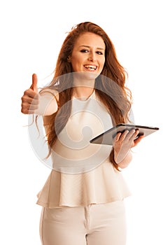 Business woman brousing the web on a tablet showing thumb up as