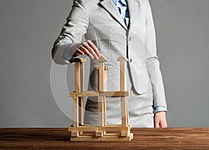 Business woman building construction on table