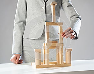 Business woman building construction on table