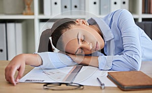 Business woman, burnout and tired while sleeping on desk, fatigue and fail with mistake, mental health at office