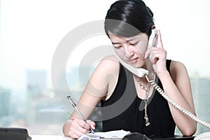 Business woman busing on phone