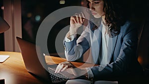 Business woman busy overtime work sitting dark office close up. Girl typing