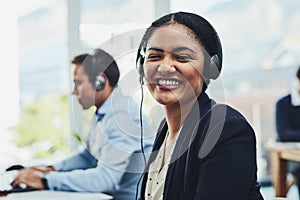 Business woman, call center and portrait smile with headphones in customer service, support or telemarketing at office