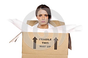 Business woman in a cardboard box