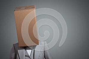 Business woman with a cardboard box head