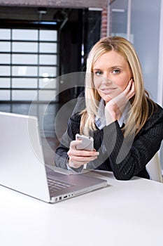 Business Woman on cell at desk