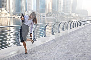 Business woman checking her high heels.