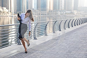 Business woman checking her high heels.