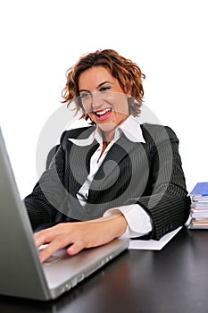 Business Woman Cheerfully Working at her Desk