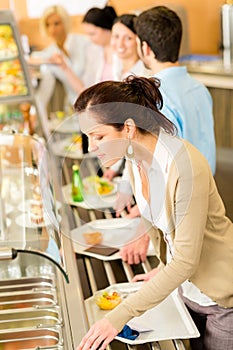 Business woman choose cafeteria lunch buffet