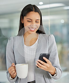 Business woman, coffee and phone for networking in office, employee and social media break at work. Female person