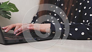 Business woman college university student using laptop computer at desk, female hands typing on notebook keyboard