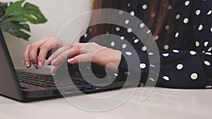 Business woman college university student using laptop computer at desk, female hands typing on notebook keyboard