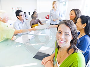 Business woman in conference with associates