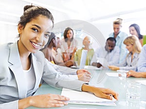 Business woman in conference with associates photo