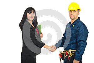Business woman and constructor worker deal