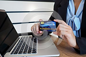 Business woman consumer spending via credit card and internet banking for shopping online