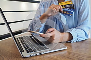 Business woman consumer spending via credit card and internet banking for shopping online