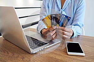 Business woman consumer spending via credit card and internet banking for shopping online