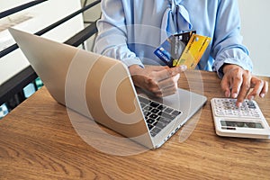 Business woman consumer spending via credit card and internet banking for shopping online