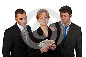 Business woman counting money with colleagues