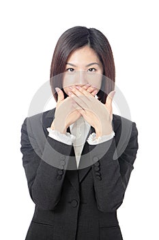 Business woman covering with hands her mouth