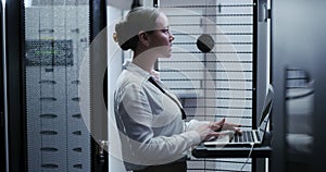 Business woman, data center and computer for maintenance, system and hardware or software backup in cybersecurity. Asian