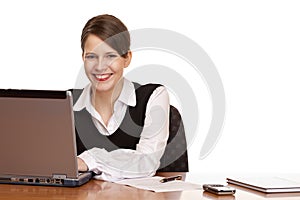 Business woman on desk works on laptop