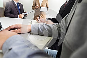 Business woman discussing finance chart on a touch pad giving a