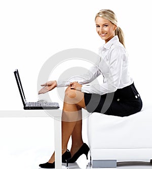 Business woman displaying a laptop