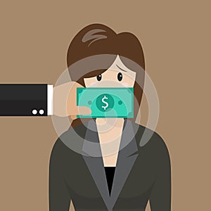 Business woman with dollar banknote taped to mouth