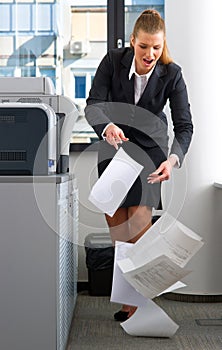 Business woman dropping documents photo