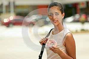 Business Woman Eating Donut For Breakfast Commuting To Work